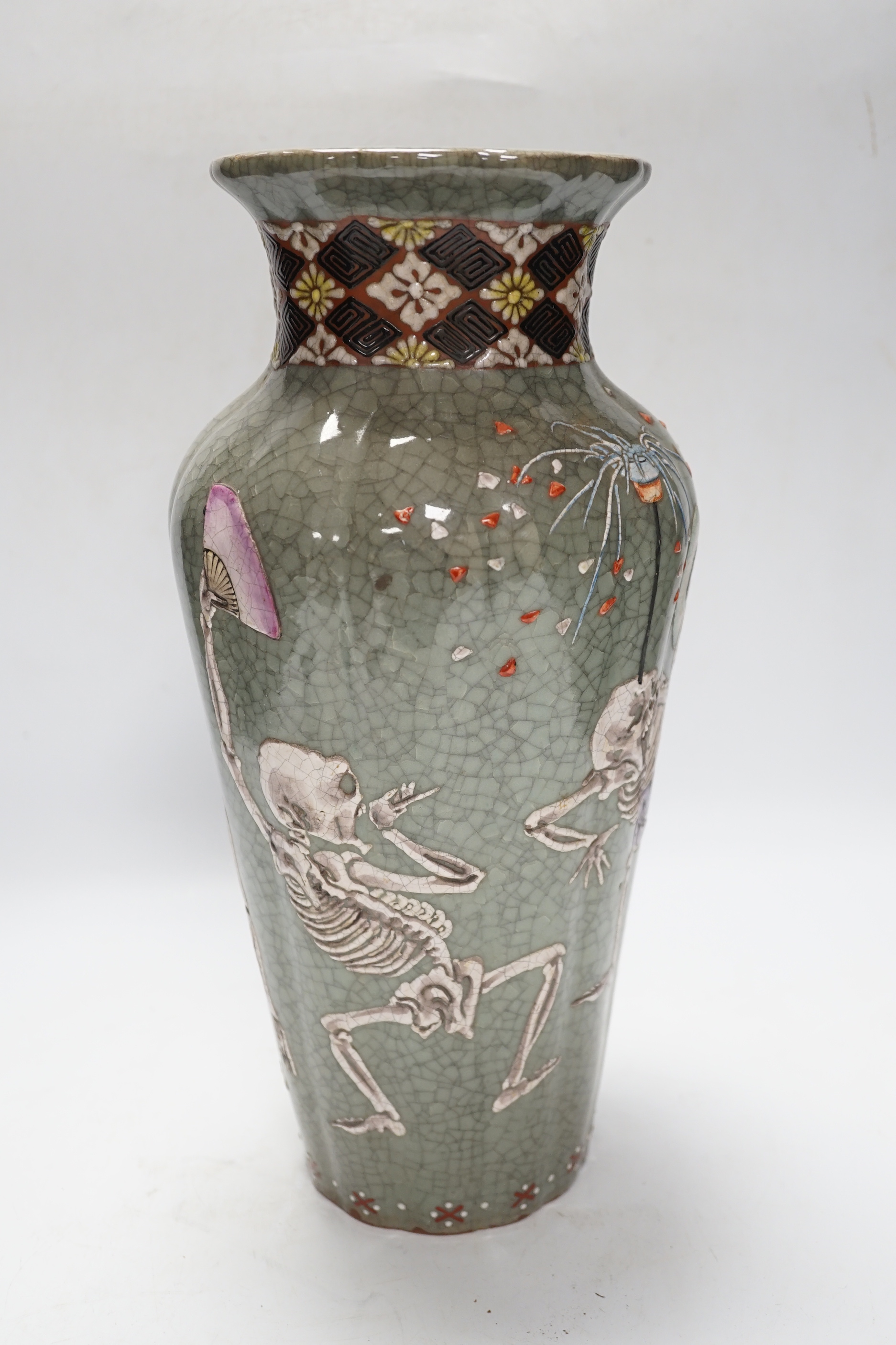 A Japanese crackleware pottery vase decorated with skeletons, 35cm high